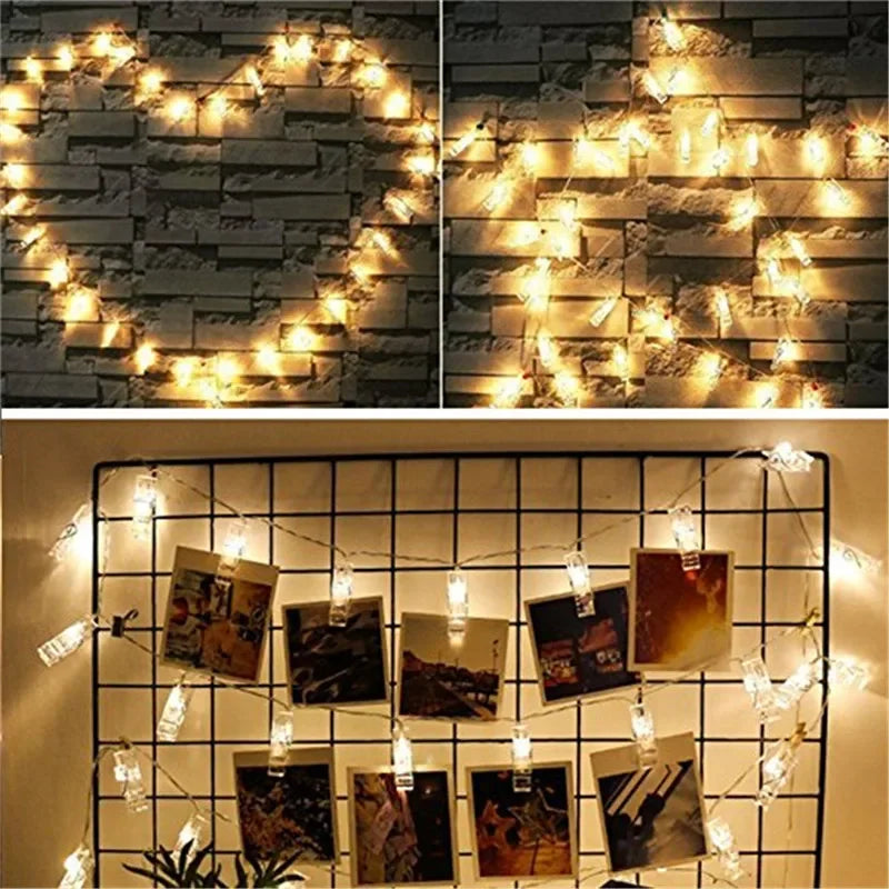 Photo clips holding polaroids on lit string