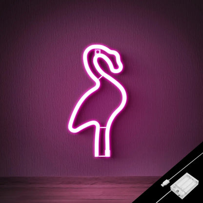 Neon flamingo light on a purple wall with power adapter.