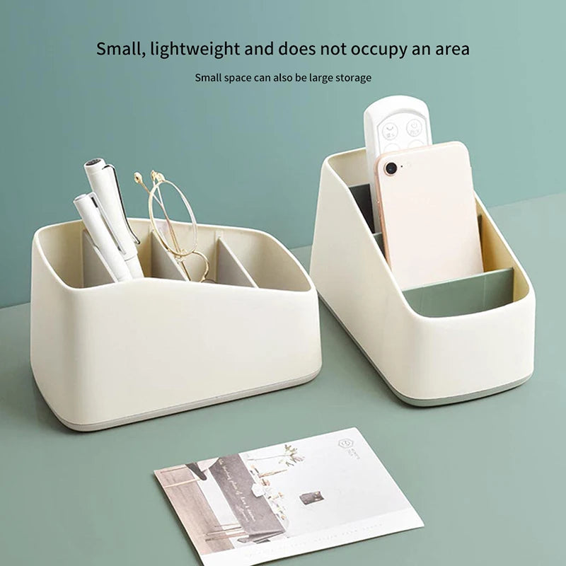 Remote caddy holding a phone and stationery on a desk