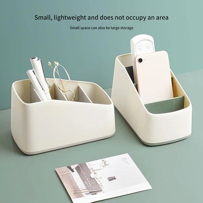 Remote caddy holding a phone and stationery on a desk