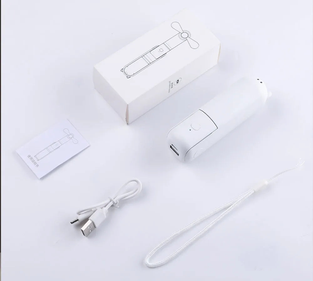 White electronic device with USB cable and packaging on a light gray background
