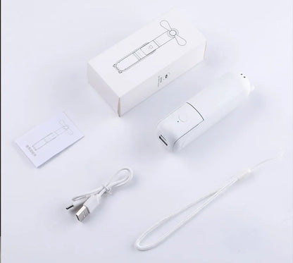 White electronic device with USB cable and packaging on a light gray background