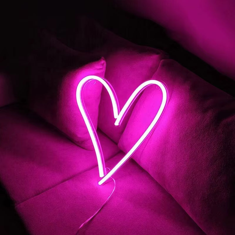 Heart neon light glowing in bedroom decor