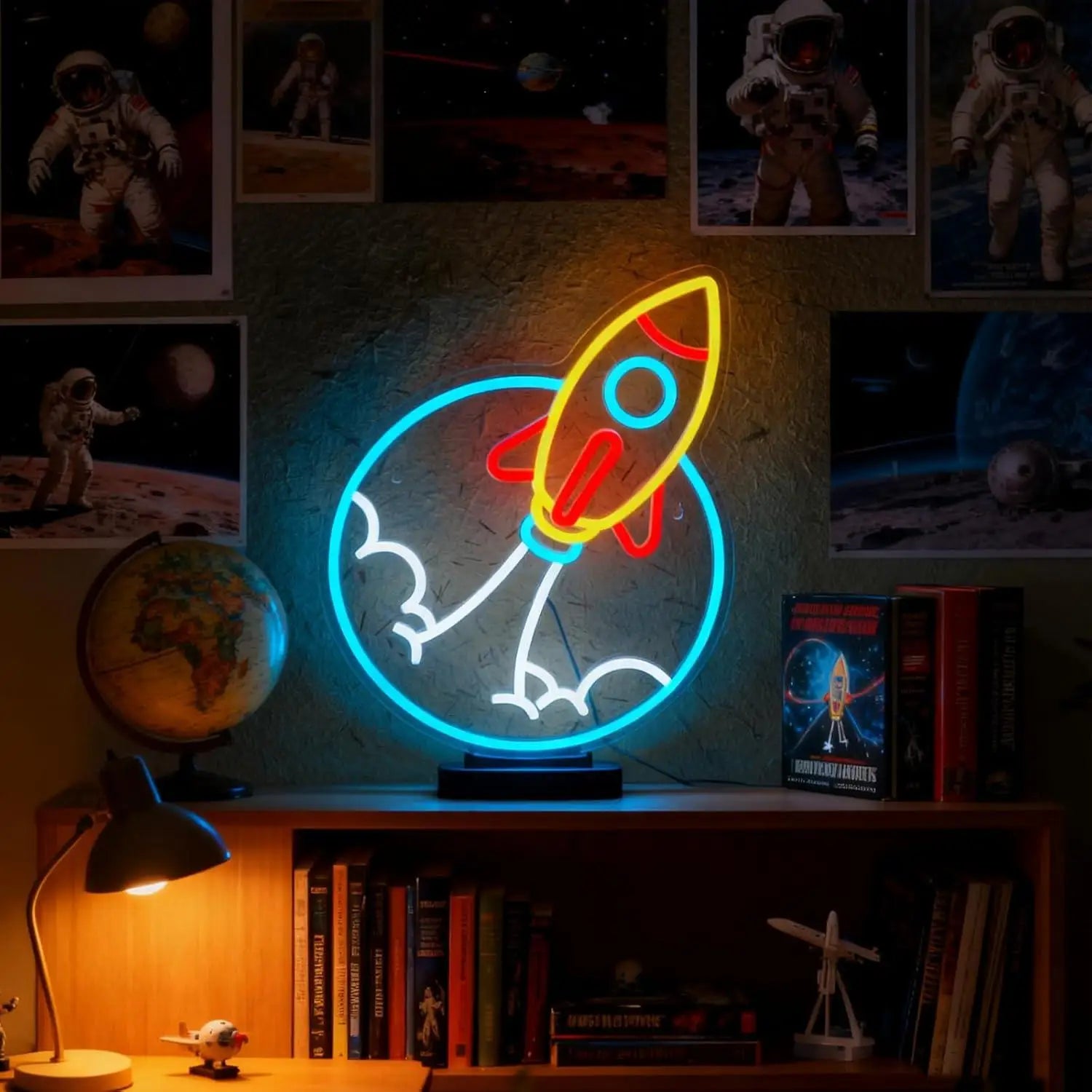 Neon sign of a rocket ship on a shelf with space-themed decor