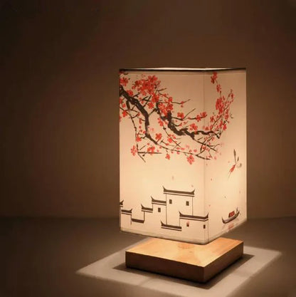 Illuminated vintage wooden lamp with hand-painted landscape, warm ambient glow perfect for reading and room atmosphere