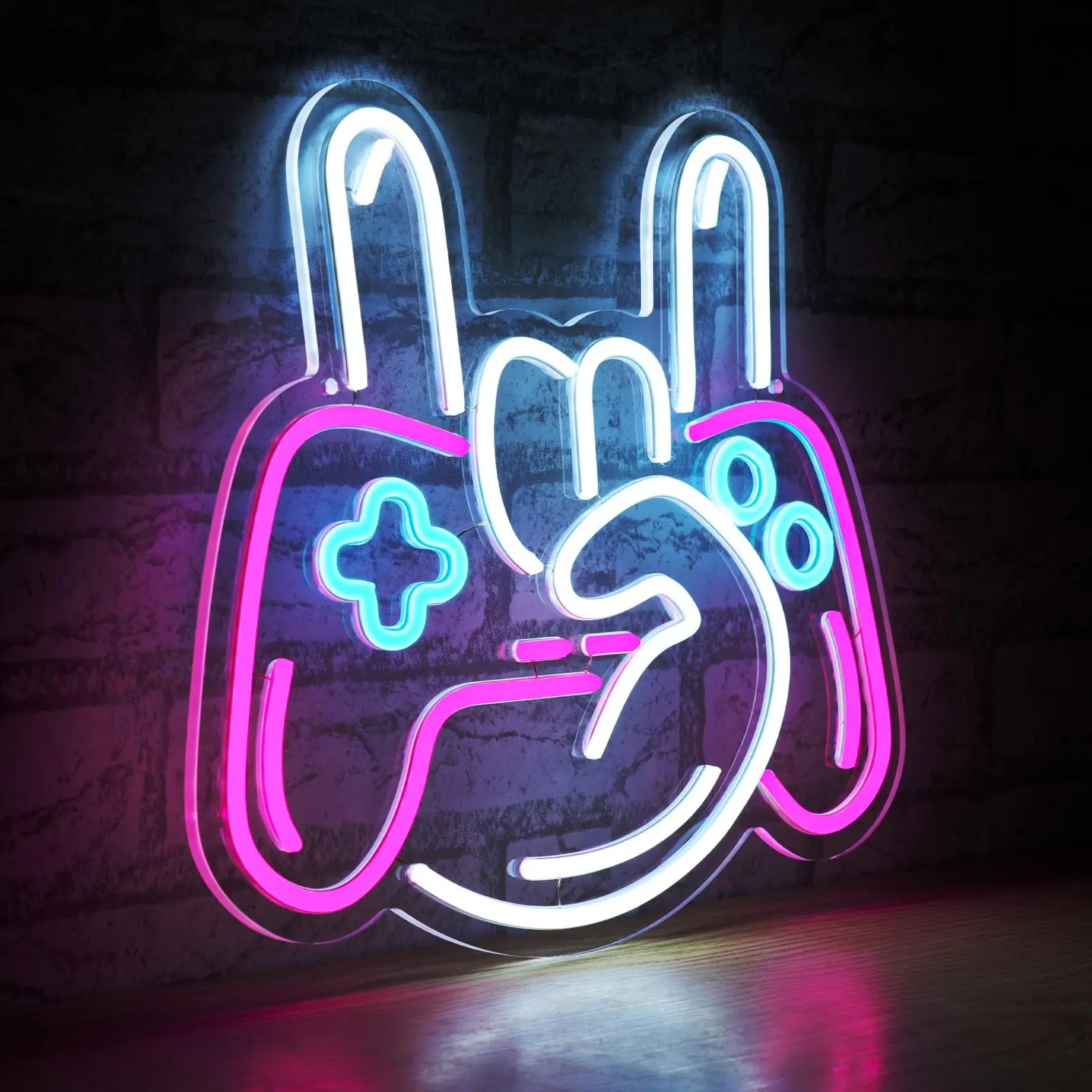 Neon sign shaped like a game controller with colorful lights on a dark background