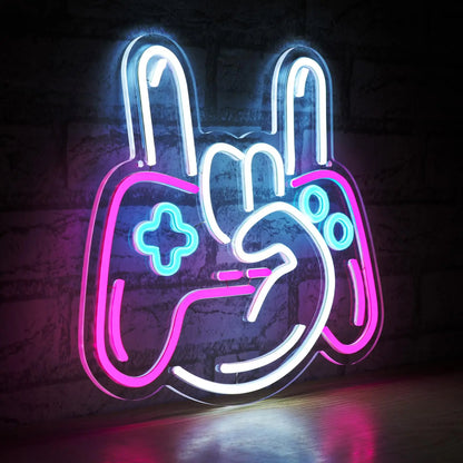 Neon sign shaped like a game controller with colorful lights on a dark background