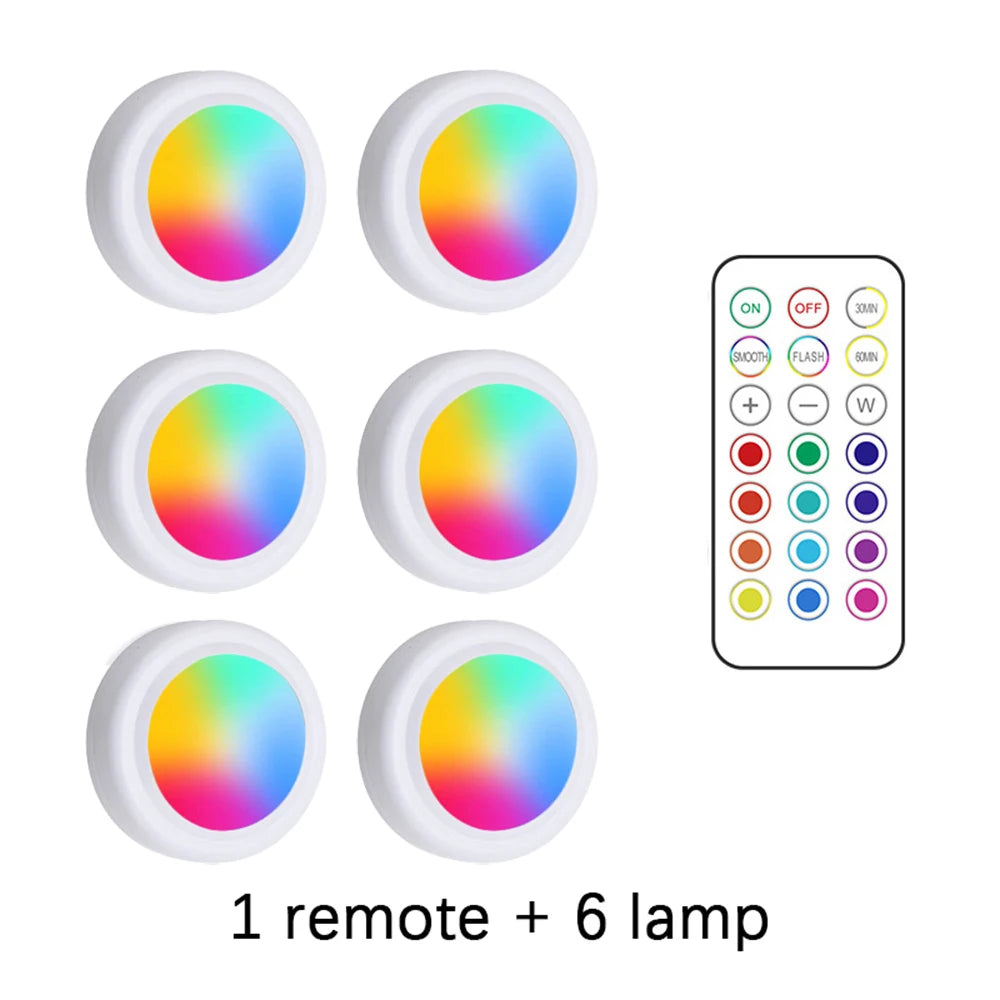 Set of six colorful LED lamps with a remote control on a white background