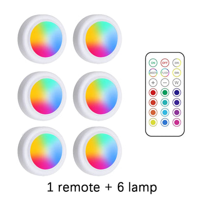 Set of six colorful LED lamps with a remote control on a white background