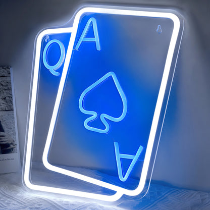 Neon sign of playing cards with 'A' and 'Q' on a white background