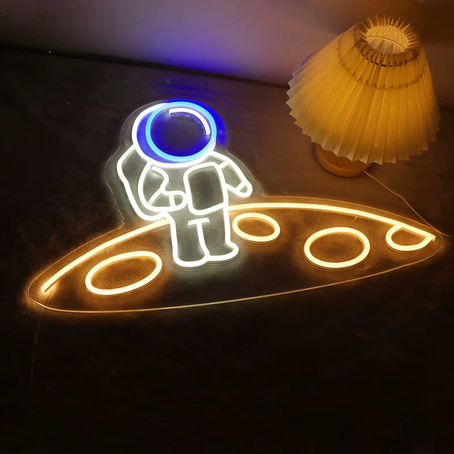 Spaceman on planet neon light glowing in bedroom