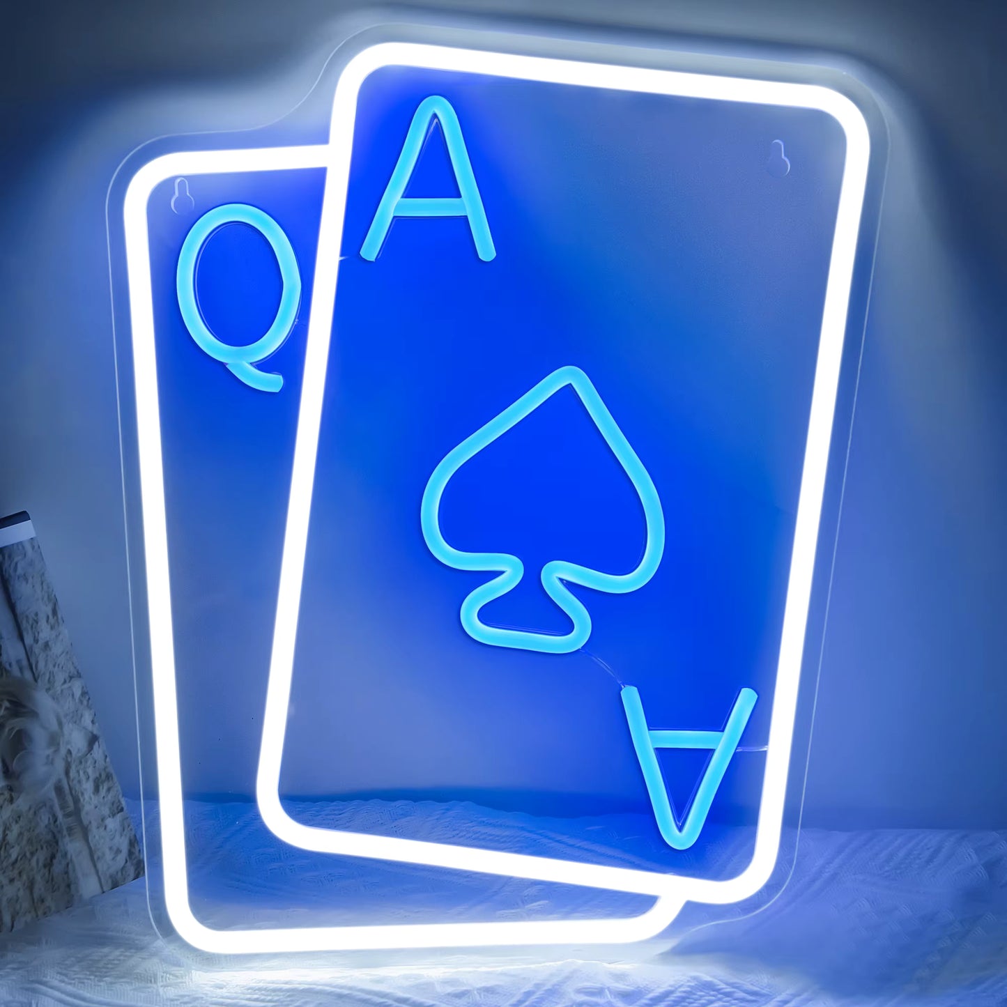 Poker neon light glowing in casino themed room