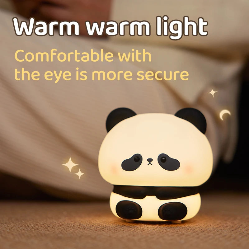 Cute panda-shaped night light with text 'Warm warm light Comfortable with the eye is more secure' on a soft background.