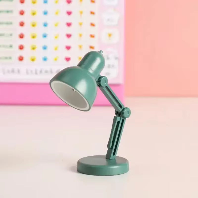 Foldable LED light clipped onto book pages