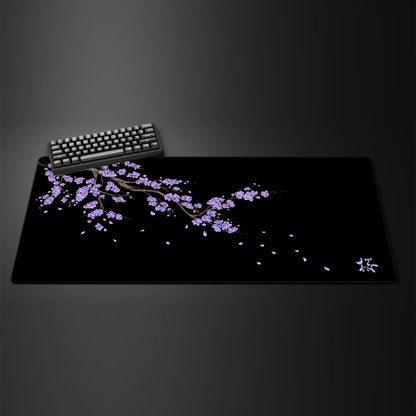 Black desk mat with a purple cherry blossom design, view 9